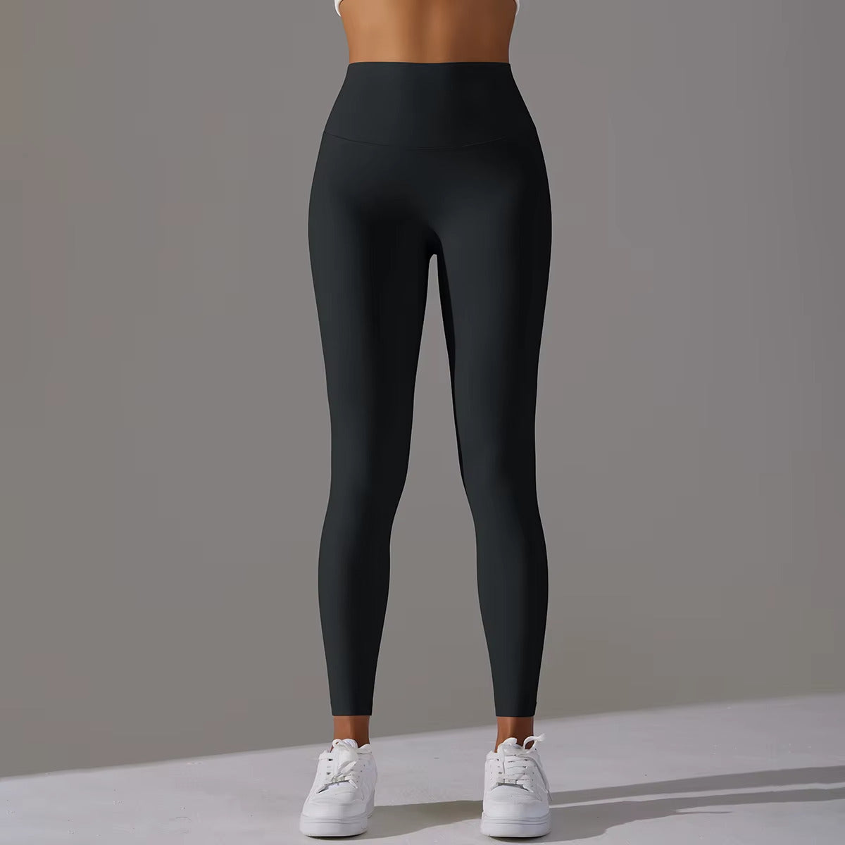 legging-sport-femme-noir-jambes-musclees-femme